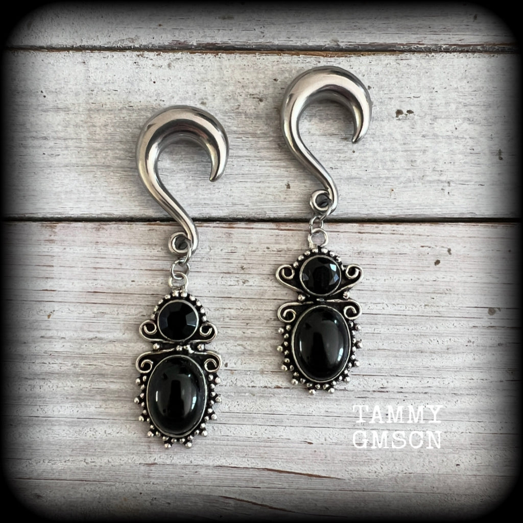 These earrings feature gorgeous pitch black onyx gemstones, lovely and dangly at approx 8cms from tip to tip, and weighing approx 15 grams each.

These earrings have been made on 0 gauge (8mm) surgical steel half curl hooks, to be worn in stretched lobes.