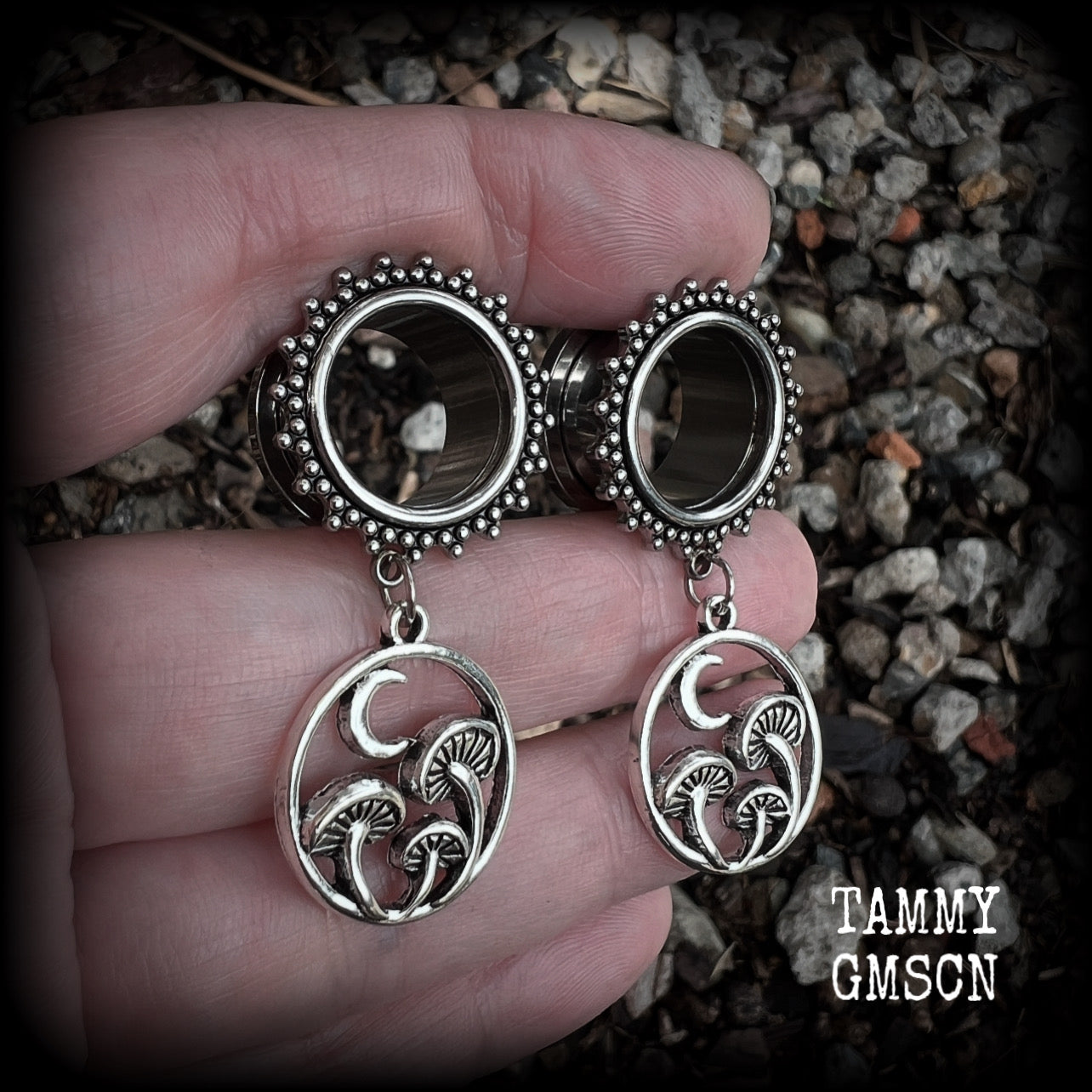 These gorgeous fairycore tunnels have been made with antique silver crescent moon and mushroom charms, are lovely and light weight, weighing in at 9 grams each and measure 5 cms from tip to tip.

This pair have been with 5/8” gauge (16mm) surgical steel ornate screw fit tunnels-for stretched lobes.