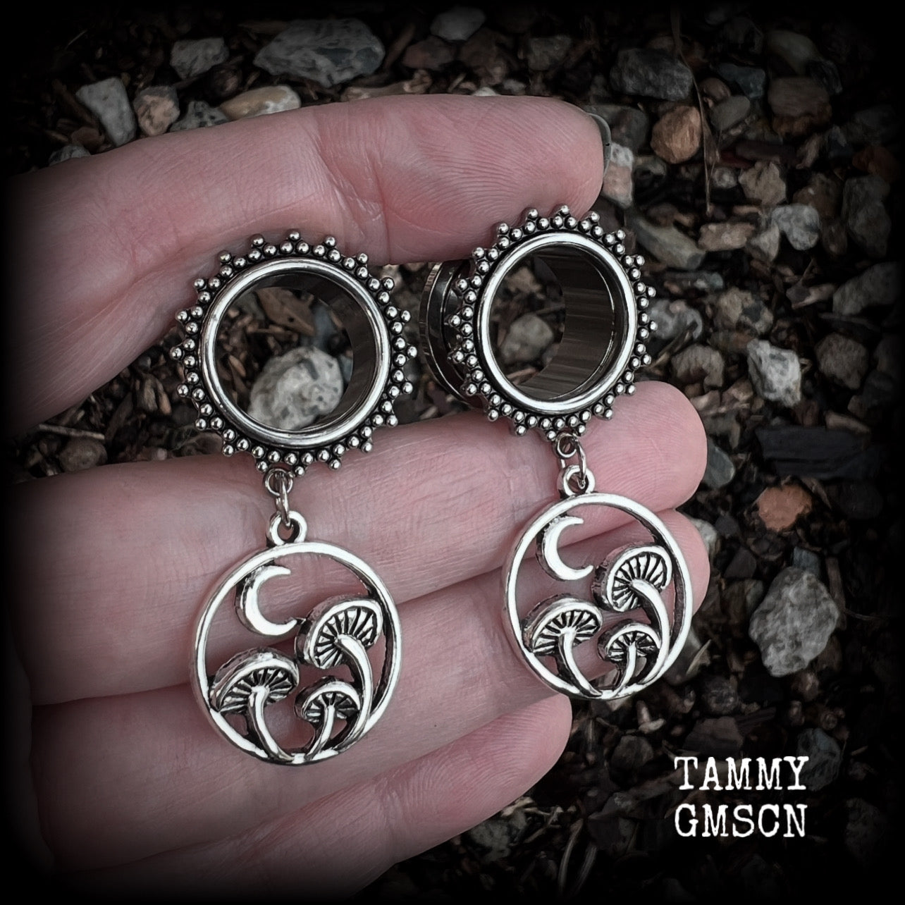 These gorgeous fairycore tunnels have been made with antique silver crescent moon and mushroom charms, are lovely and light weight, weighing in at 9 grams each and measure 5 cms from tip to tip.

This pair have been with 5/8” gauge (16mm) surgical steel ornate screw fit tunnels-for stretched lobes.