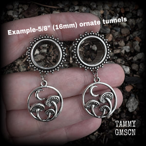 These gorgeous fairycore tunnels have been made with antique silver crescent moon and mushroom charms, are lovely and light weight, weighing in at 9 grams each and measure 5 cms from tip to tip.

This pair have been with 5/8” gauge (16mm) surgical steel ornate screw fit tunnels-for stretched lobes.