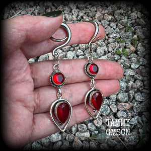 These beautiful gauged earrings feature gorgeous deep red faceted garnet gemstones in an ornate antique silver setting, measuring 7cms from tip to tip, and weighing approx 10 grams each, nice and light weight.

These earrings have been made on 6 gauge (4mm) surgical steel full curl hooks, to be worn in stretched lobes.