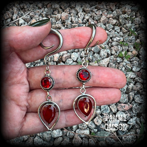 These beautiful gauged earrings feature gorgeous deep red faceted garnet gemstones in an ornate antique silver setting, measuring 7cms from tip to tip, and weighing approx 10 grams each, nice and light weight.

These earrings have been made on 6 gauge (4mm) surgical steel full curl hooks, to be worn in stretched lobes.