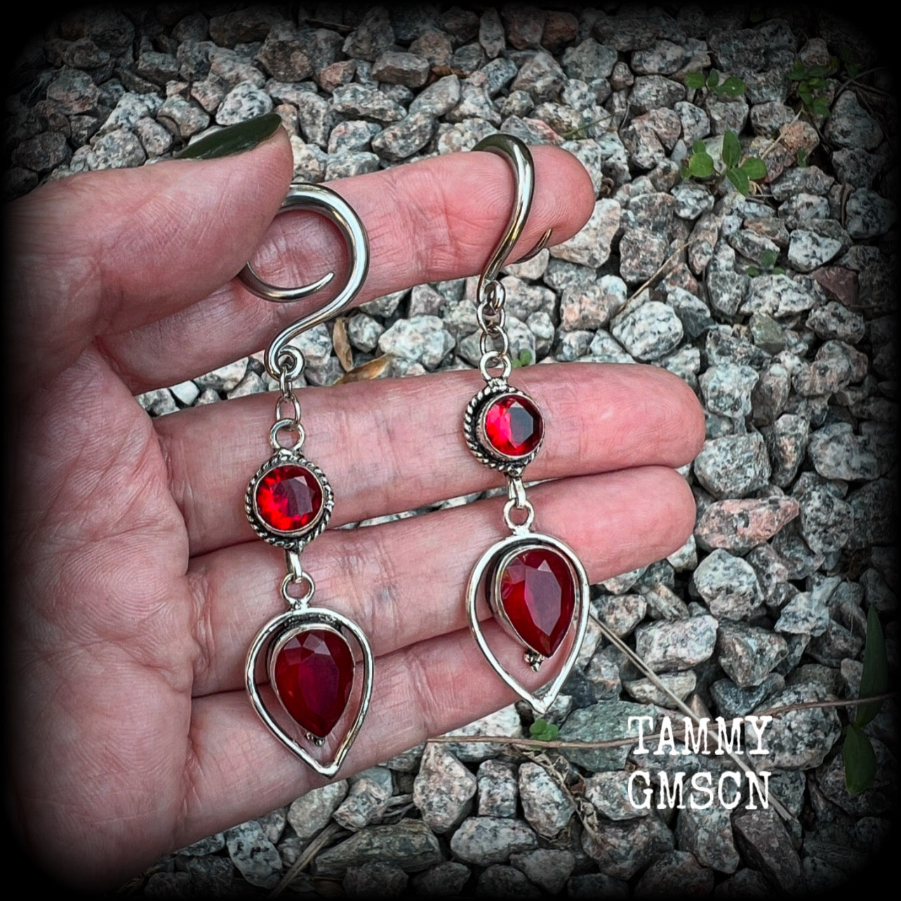 These beautiful gauged earrings feature gorgeous deep red faceted garnet gemstones in an ornate antique silver setting, measuring 7cms from tip to tip, and weighing approx 10 grams each, nice and light weight.

These earrings have been made on 6 gauge (4mm) surgical steel full curl hooks, to be worn in stretched lobes.