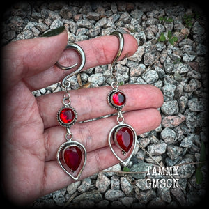 These beautiful gauged earrings feature gorgeous deep red faceted garnet gemstones in an ornate antique silver setting, measuring 7cms from tip to tip, and weighing approx 10 grams each, nice and light weight.

These earrings have been made on 6 gauge (4mm) surgical steel full curl hooks, to be worn in stretched lobes.