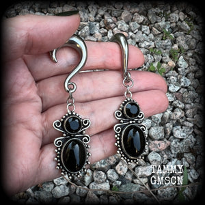 These earrings feature gorgeous pitch black onyx gemstones, lovely and dangly at approx 8cms from tip to tip, and weighing approx 15 grams each.

These earrings have been made on 0 gauge (8mm) surgical steel half curl hooks, to be worn in stretched lobes.