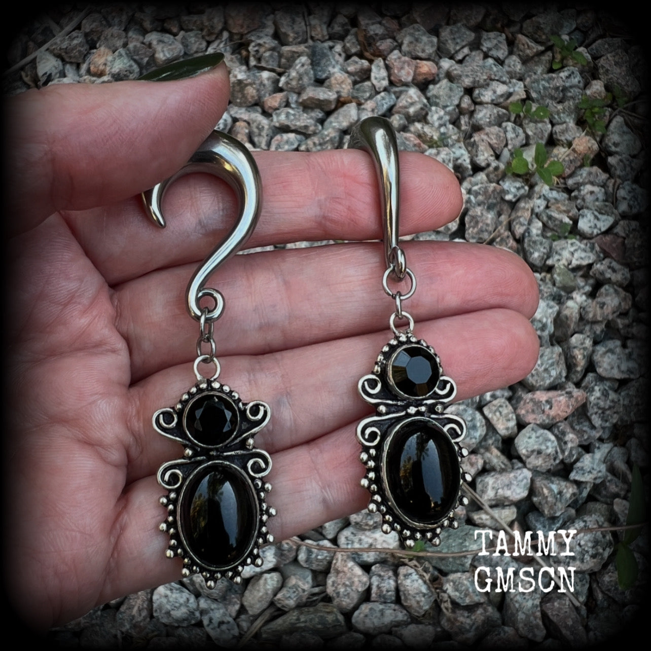 These earrings feature gorgeous pitch black onyx gemstones, lovely and dangly at approx 8cms from tip to tip, and weighing approx 15 grams each.

These earrings have been made on 0 gauge (8mm) surgical steel half curl hooks, to be worn in stretched lobes.