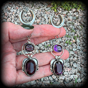 These gorgeous gauged earrings feature beautiful purple facet amethyst gemstones in an antique silver gypsy boho style setting, measuring just on 6cms from tip to tip, and weighing approx 6 grams each, not too heavy...

This pair have been made on 5/8” gauge (16mm) surgical steel cradles-suitable for stretched lobes.
