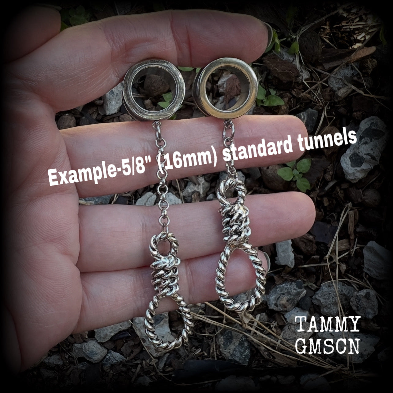 These awesome tunnel dangles feature classic antique silver hangmans nooses dangling from differing lengths of stainless steel chain, weighing only 11 grams each and measuring 9cms from tip to tip.

This pair has made on 5/8" (16mm) gauge standard surgical steel screw fit tunnels.