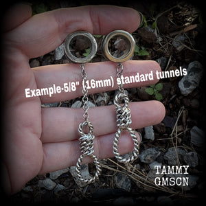 These awesome tunnel dangles feature classic antique silver hangmans nooses dangling from differing lengths of stainless steel chain, weighing only 11 grams each and measuring 9cms from tip to tip.

This pair has made on 5/8" (16mm) gauge standard surgical steel screw fit tunnels.
