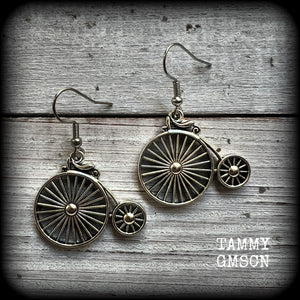 These adorably quirky Victorian era 'Penny Farthing' earrings are too cute!!
Measuring in at just under 5cms from tip to tip, these adorable earrings are also lightweight, weighing only a few grams each.

This pair has been made on stainless steel french hooks, for pierced ears.