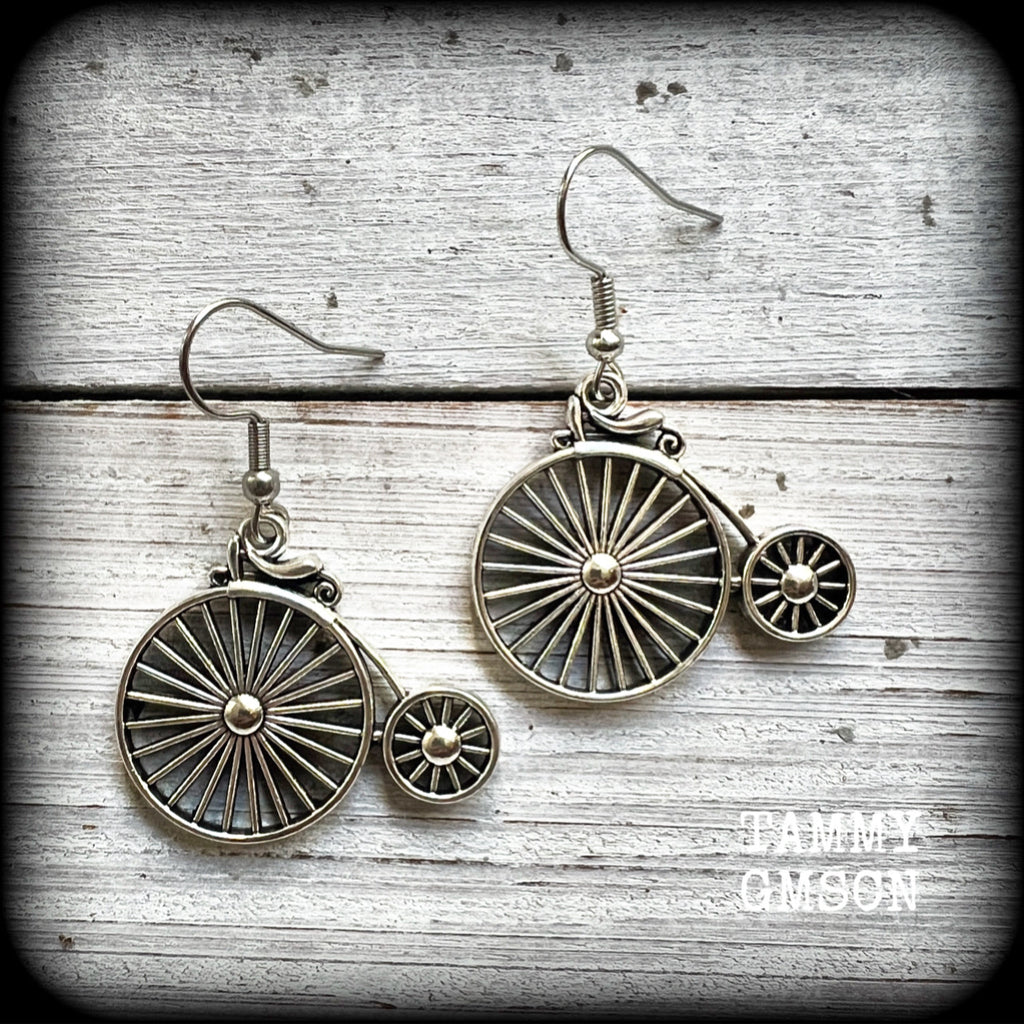 These adorably quirky Victorian era 'Penny Farthing' earrings are too cute!!
Measuring in at just under 5cms from tip to tip, these adorable earrings are also lightweight, weighing only a few grams each.

This pair has been made on stainless steel french hooks, for pierced ears.