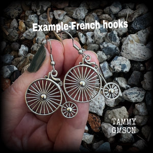 These adorably quirky Victorian era 'Penny Farthing' earrings are too cute!! Measuring in at just under 5cms from tip to tip, these adorable earrings are also lightweight, weighing only a few grams each.  This pair has been made on stainless steel french hooks, for pierced ears.