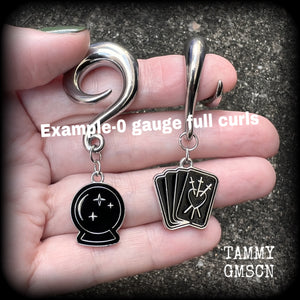 These gorgeous spooky tunnel dangles feature cute black enamel crystal ball and tarot card charms, are nice and lightweight-weighing only 7 grams each and measure 5cms from tip to tip.

This pair have been made on 0 gauge (8mm) full curls for stretched lobes