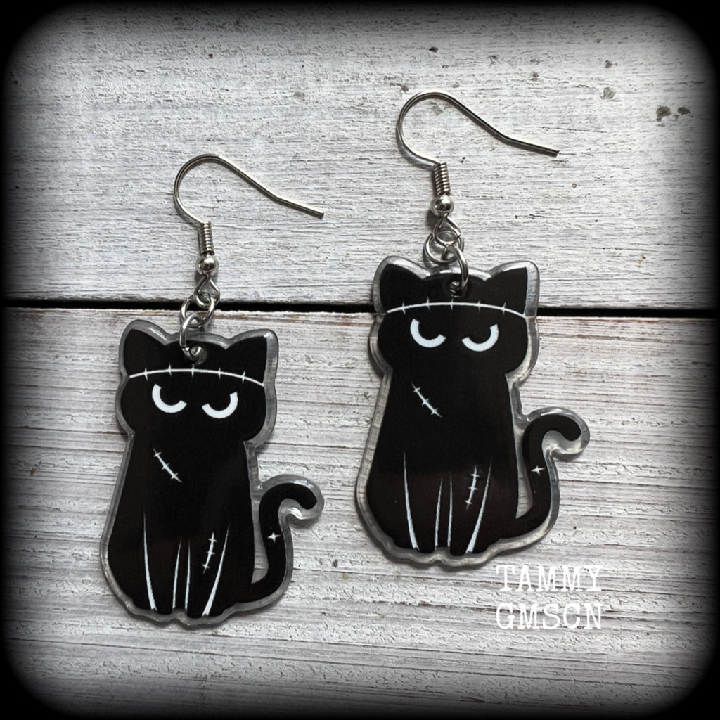 These awesome acrylic 'Zombie kitty' earrings measure in at just over 6cms from tip to tip, and are nice and dangly and nice and lightweight, weighing only a few grams each.

This pair has been made on stainless steel french hooks-suitable for pierced ears.