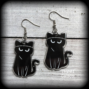 These awesome acrylic 'Zombie kitty' earrings measure in at just over 6cms from tip to tip, and are nice and dangly and nice and lightweight, weighing only a few grams each.

This pair has been made on stainless steel french hooks-suitable for pierced ears.