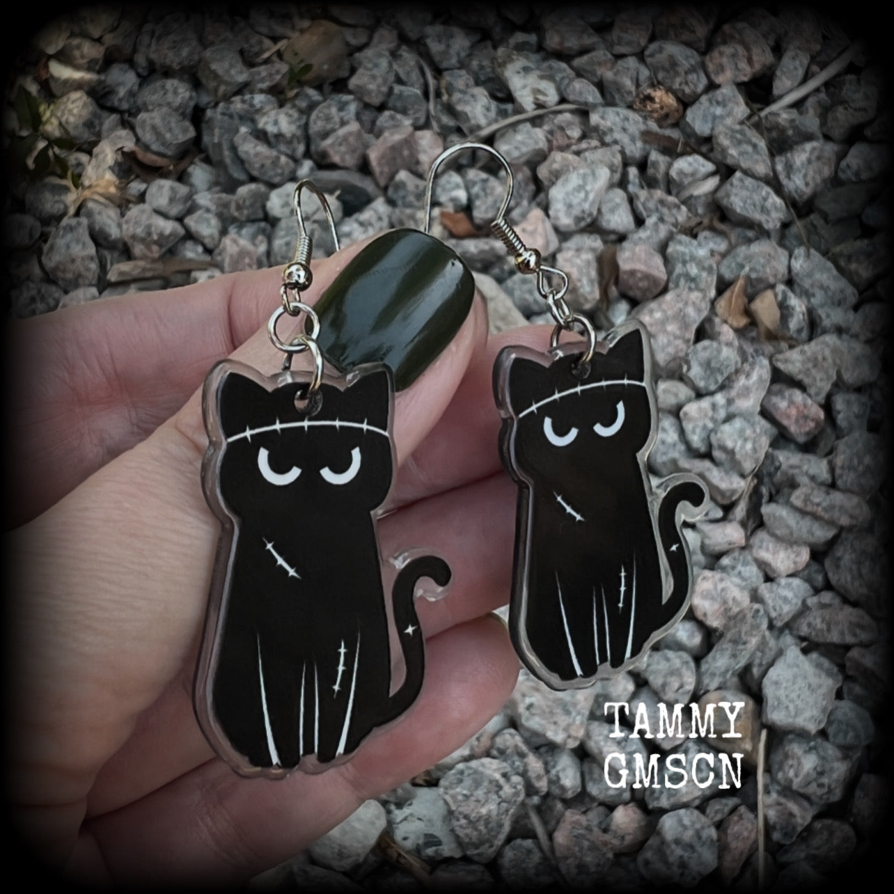 These awesome acrylic 'Zombie kitty' earrings measure in at just over 6cms from tip to tip, and are nice and dangly and nice and lightweight, weighing only a few grams each.  This pair has been made on stainless steel french hooks-suitable for pierced ears.
