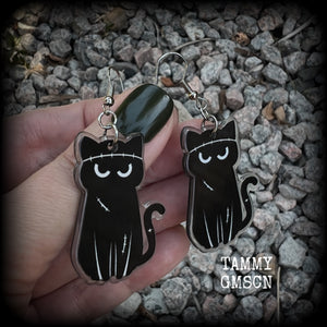 These awesome acrylic 'Zombie kitty' earrings measure in at just over 6cms from tip to tip, and are nice and dangly and nice and lightweight, weighing only a few grams each.  This pair has been made on stainless steel french hooks-suitable for pierced ears.