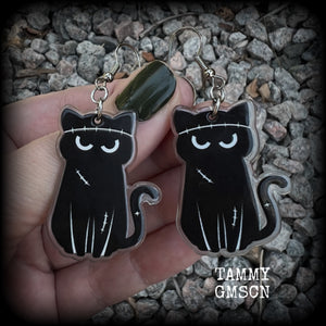 These awesome acrylic 'Zombie kitty' earrings measure in at just over 6cms from tip to tip, and are nice and dangly and nice and lightweight, weighing only a few grams each.  This pair has been made on stainless steel french hooks-suitable for pierced ears.