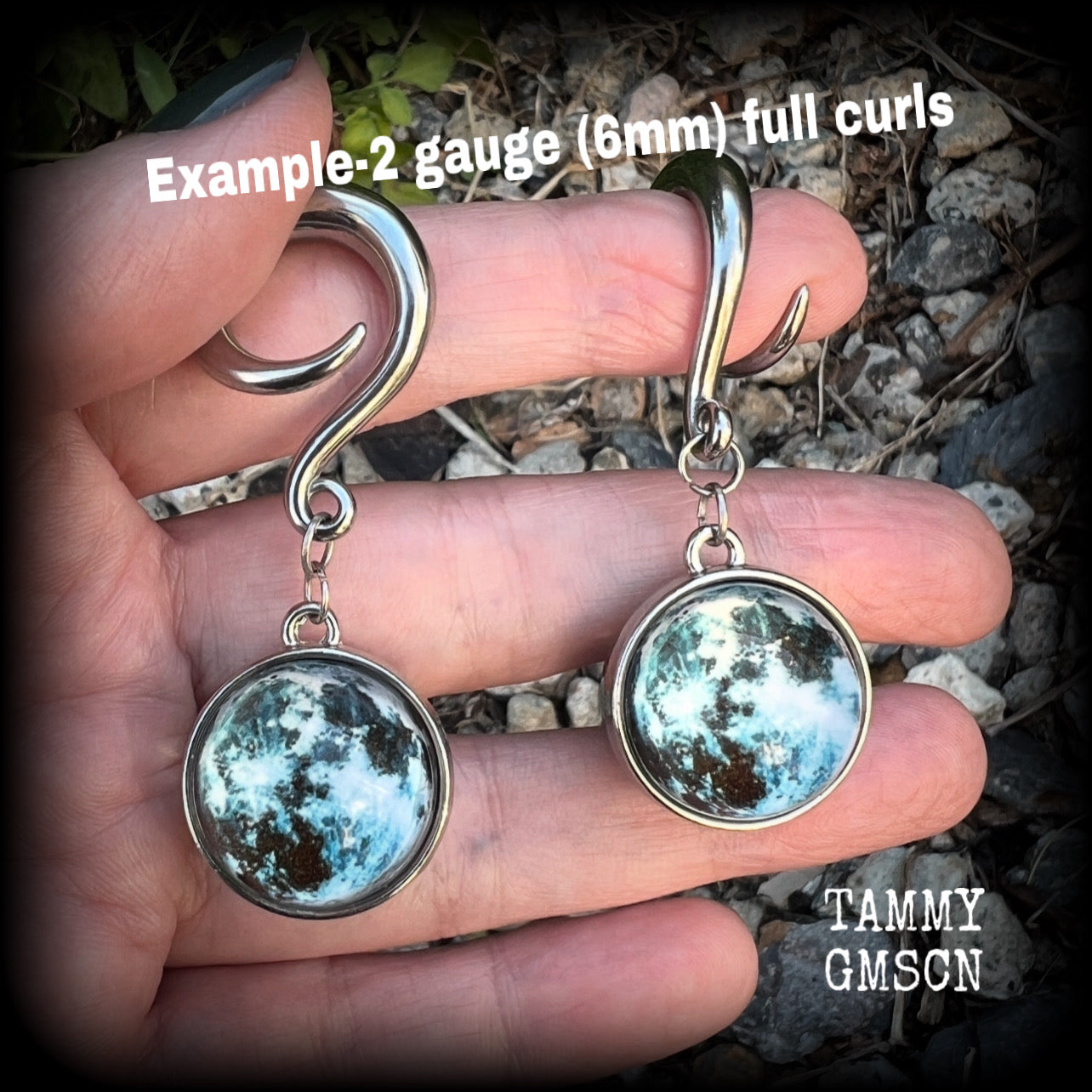 These gorgeous earrings feature a full moon globe (double sided as shown in photo examples) and measuring approx 6cms from top to bottom, these earrings weigh approx. 21 grams a piece.

This pair have been made on 2 gauge (6mm) surgical steel full curls, to be worn in stretched lobes.