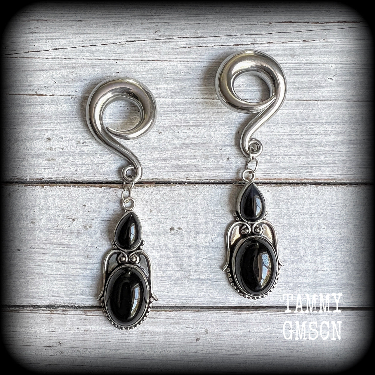 These earrings have been made with gorgeous pitch black obsidian gemstones, lovely and dangly at just over 8cms from tip to tip, and weighing approx 20 grams each.

These earrings have been made on 0 gauge (8mm) surgical steel full curl hooks, to be worn in stretched lobes.