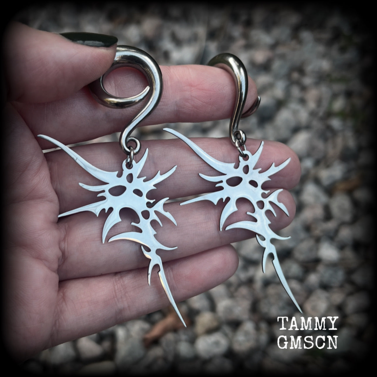 These awesome punk rock earrings feature stainless steel cybersigils, weighing approx 9 grams a piece, and nice and dangly on 8cms from tip to tip.  This pair has been made on 2 gauge (6mm) surgical steel full curl hooks, suitable for stretched lobes.