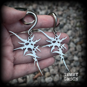 These awesome punk rock earrings feature stainless steel cybersigils, weighing approx 9 grams a piece, and nice and dangly on 8cms from tip to tip.  This pair has been made on 2 gauge (6mm) surgical steel full curl hooks, suitable for stretched lobes.