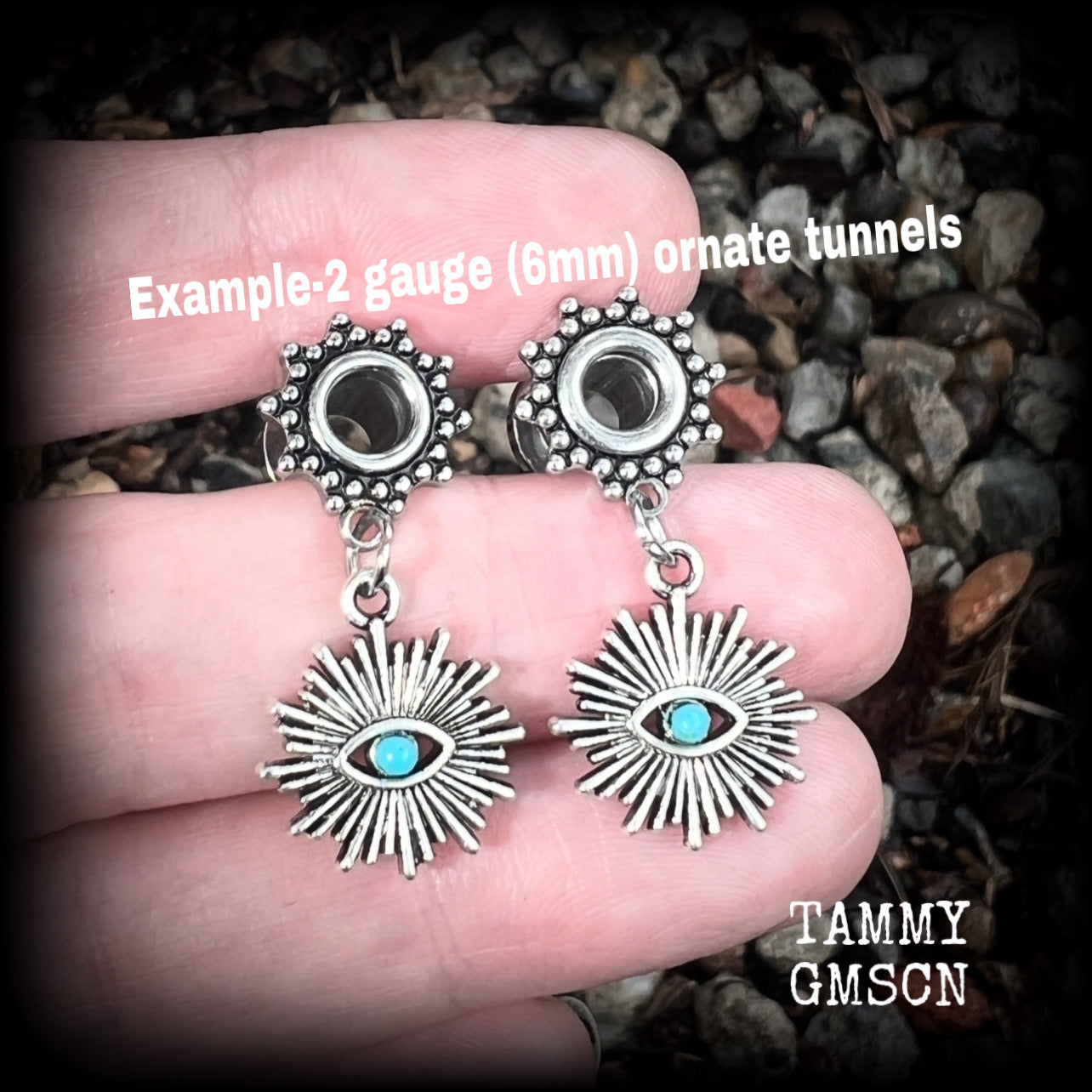 These stunning tunnel earrings feature gorgeous blue turquoise and antique silver all seeing eye charms, are nice and lightweight, weighing approx 7 grams each, measuring 3cms from tip to tip.

This pair has been made with 2 gauge (6mm) ornate surgical steel screw fit tunnels-suitable for stretched lobes.