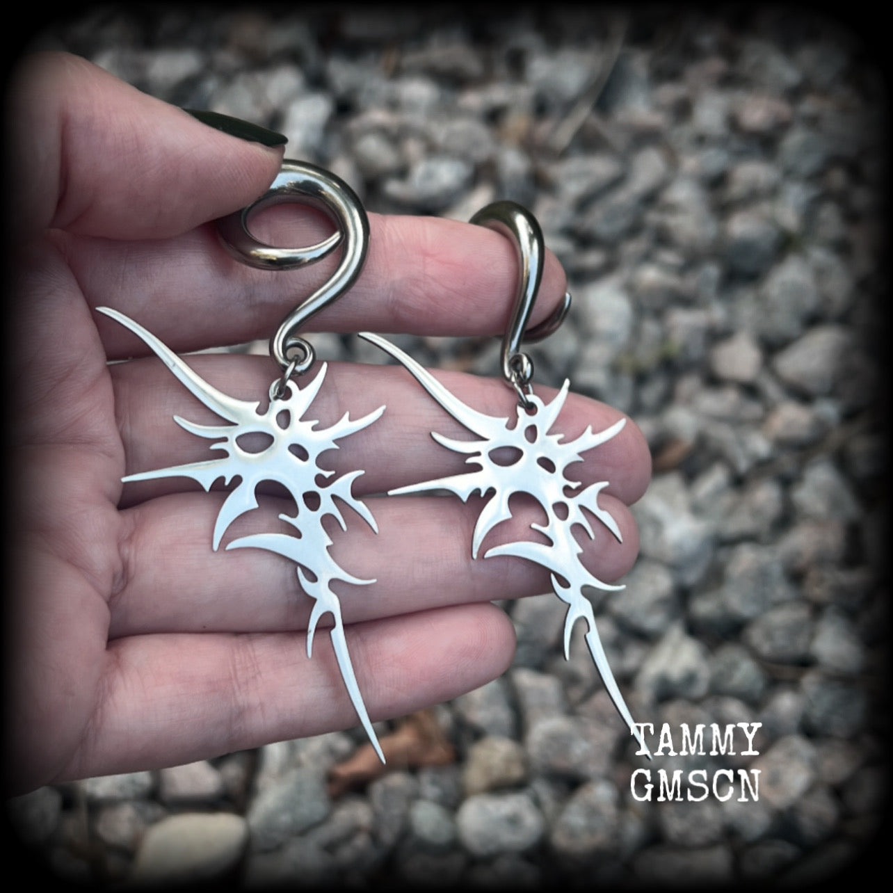 These awesome punk rock earrings feature stainless steel cybersigils, weighing approx 9 grams a piece, and nice and dangly on 8cms from tip to tip.  This pair has been made on 2 gauge (6mm) surgical steel full curl hooks, suitable for stretched lobes.
