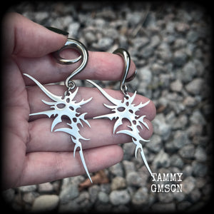 These awesome punk rock earrings feature stainless steel cybersigils, weighing approx 9 grams a piece, and nice and dangly on 8cms from tip to tip.  This pair has been made on 2 gauge (6mm) surgical steel full curl hooks, suitable for stretched lobes.