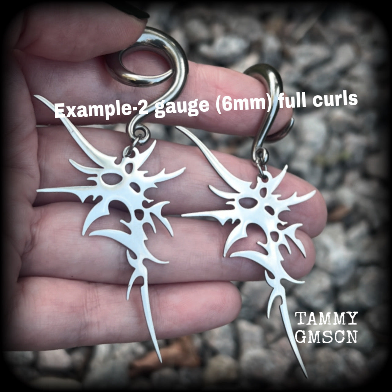 These awesome punk rock earrings feature stainless steel cybersigils, weighing approx 9 grams a piece, and nice and dangly on 8cms from tip to tip.  This pair has been made on 2 gauge (6mm) surgical steel full curl hooks, suitable for stretched lobes.