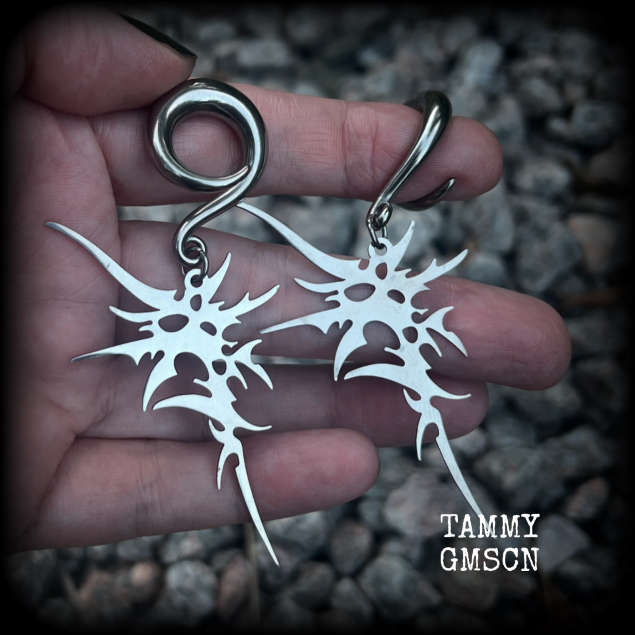 These awesome punk rock earrings feature stainless steel cybersigils, weighing approx 9 grams a piece, and nice and dangly on 8cms from tip to tip.  This pair has been made on 2 gauge (6mm) surgical steel full curl hooks, suitable for stretched lobes.