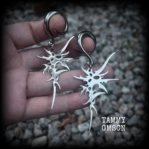 These awesome punk rock earrings feature stainless steel cybersigils, weighing approx 9 grams a piece, and nice and dangly on 8cms from tip to tip.  This pair has been made on 2 gauge (6mm) surgical steel full curl hooks, suitable for stretched lobes.