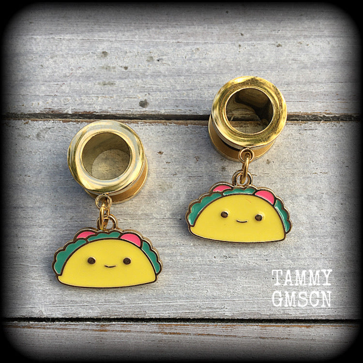 These adorable tunnel earrings feature cute little smiling tacos, weigh approx 5 grams each, and measure just over 3cms from tip to tip.

This pair has been made with 00 gauge (10mm) surgical steel screw fit tunnels, for stretched lobes.