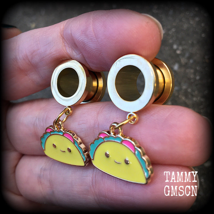 These adorable tunnel earrings feature cute little smiling tacos, weigh approx 5 grams each, and measure just over 3cms from tip to tip.

This pair has been made with 00 gauge (10mm) surgical steel screw fit tunnels, for stretched lobes.