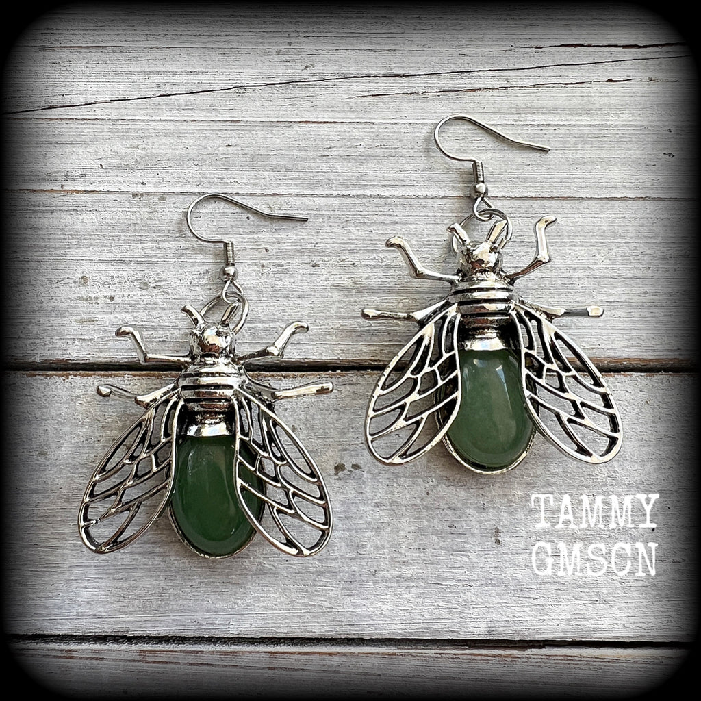 These unique earrings feature beautiful antique silver insect pendants, with gorgeous green polished aventurine cabachons.

These earrings are nice and dangly, measuring just on 6cms from tip to tip, and weighing 12 grams each.

This pair have been made with stainless steel french hooks, suitable for pierced ears.