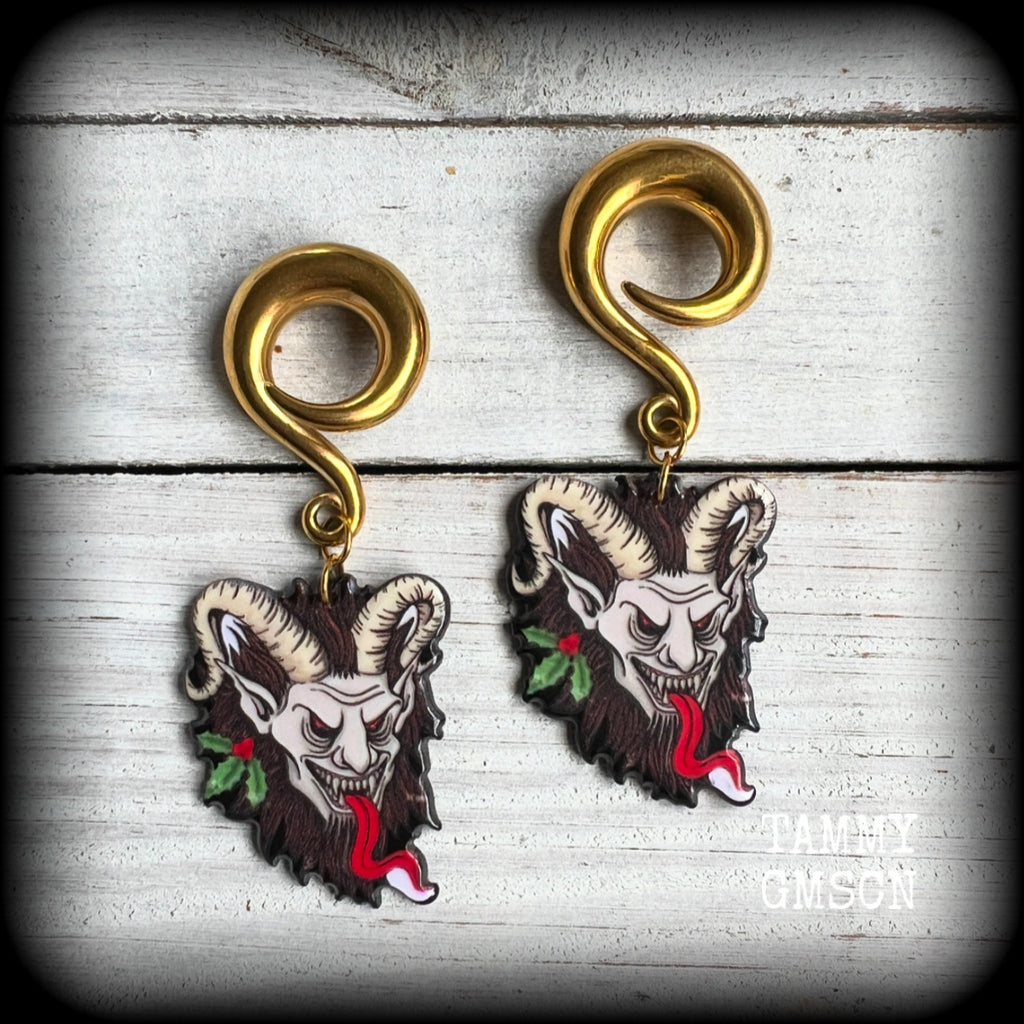 Featuring a festive horned Krampus nestled in  sprigs of holly, these acrylic earrings are lightweight, weighing approx 16 grams each and are nice and dangly, measuring just on 7.5cms cms from tip to tip. 

This pair has been made on surgical steel 0 gauge (8mm) full curls, suitable for stretched lobes.