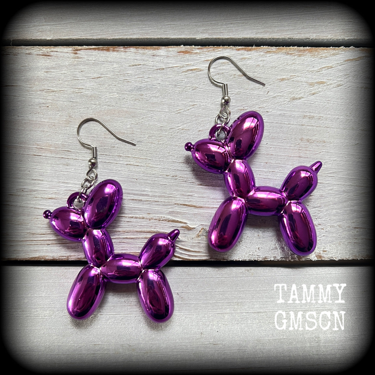 These beautiful big purple acrylic balloon dog earrings measure just over 7cms from tip to tip, and weigh approx. 5 grams a piece.

This pair has been made with stainless steel french hooks, for pierced ears.