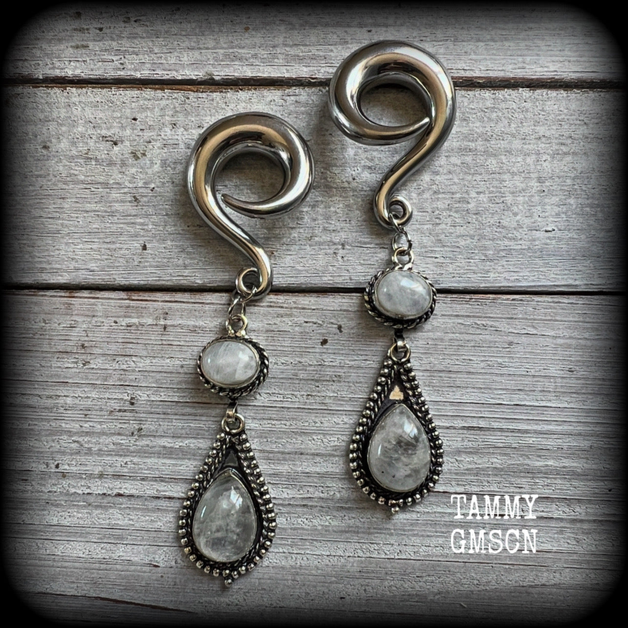These beautiful boho Rainbow moonstone earrings are made with gorgeous polished gemstones, lovely and dangly measuring approx 8.5cms from tip to tip, and weighing approx 19 grams each. 

These earrings have been made on 0 gauge (8mm) surgical steel full curl hooks, to be worn in stretched lobes.
