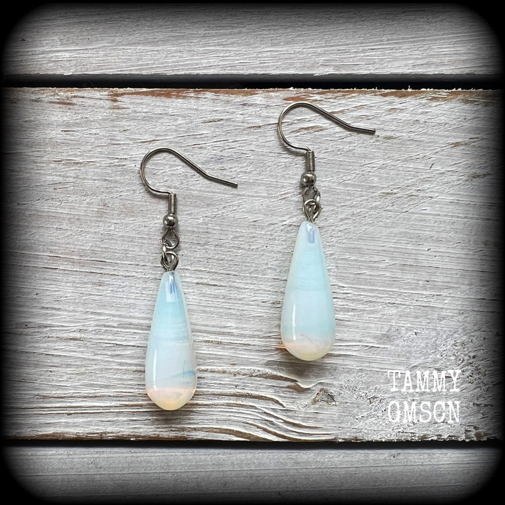 These beautiful earrings feature gorgeous transluscent opalite teardrop gemstones, are nice and dangly, measuring just over 5cms from tip to tip, and weighing only a few grams each.

This pair has been made with stainless steel french hooks, suitable for pierced ears.