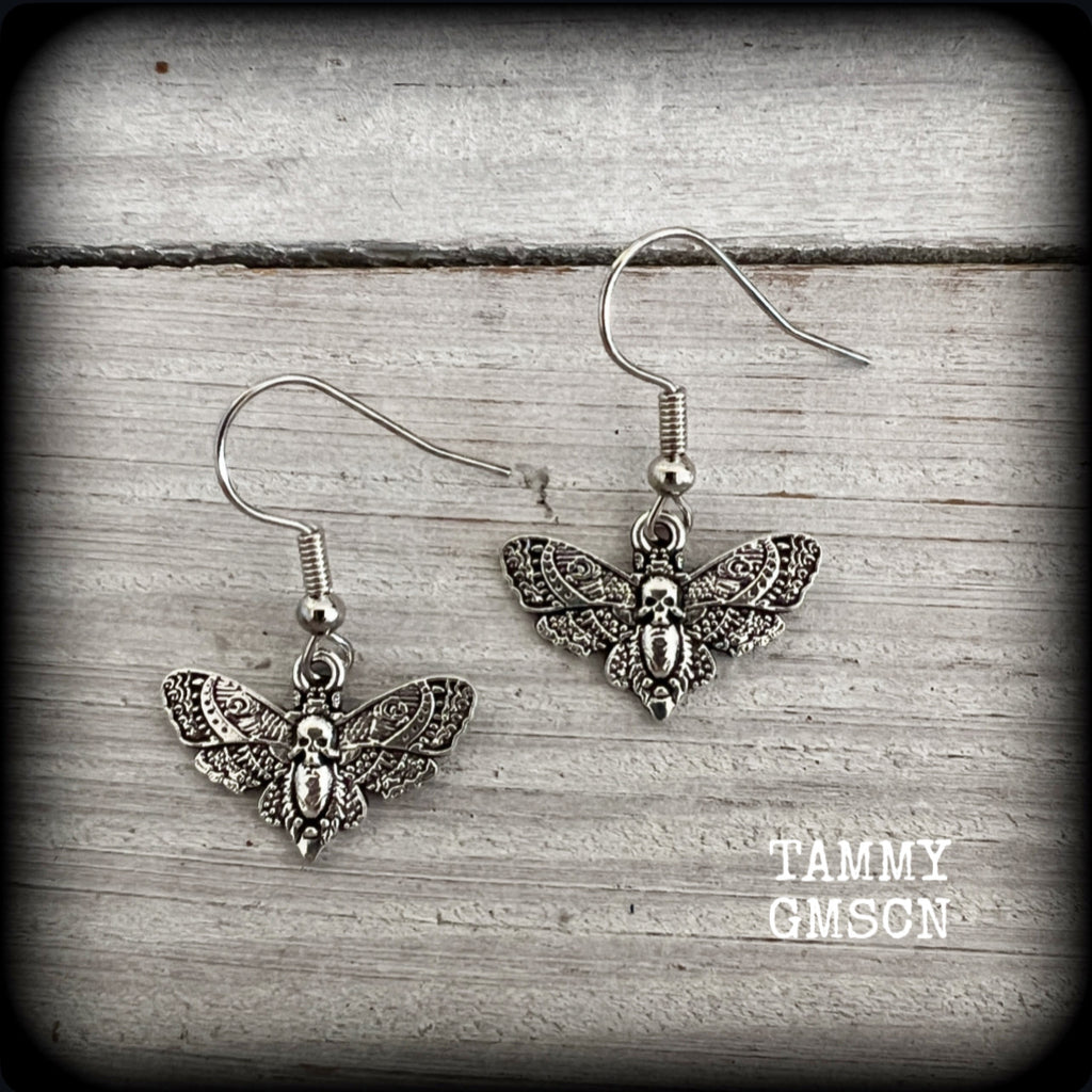 These petite antique silver Deathshead moth earrings feature a gorgeous gothic deathshead moth charm measuring just on 3cms, and weigh only a gram or two each.

This pair has been made on stainless steel french hooks, for pierced ears.