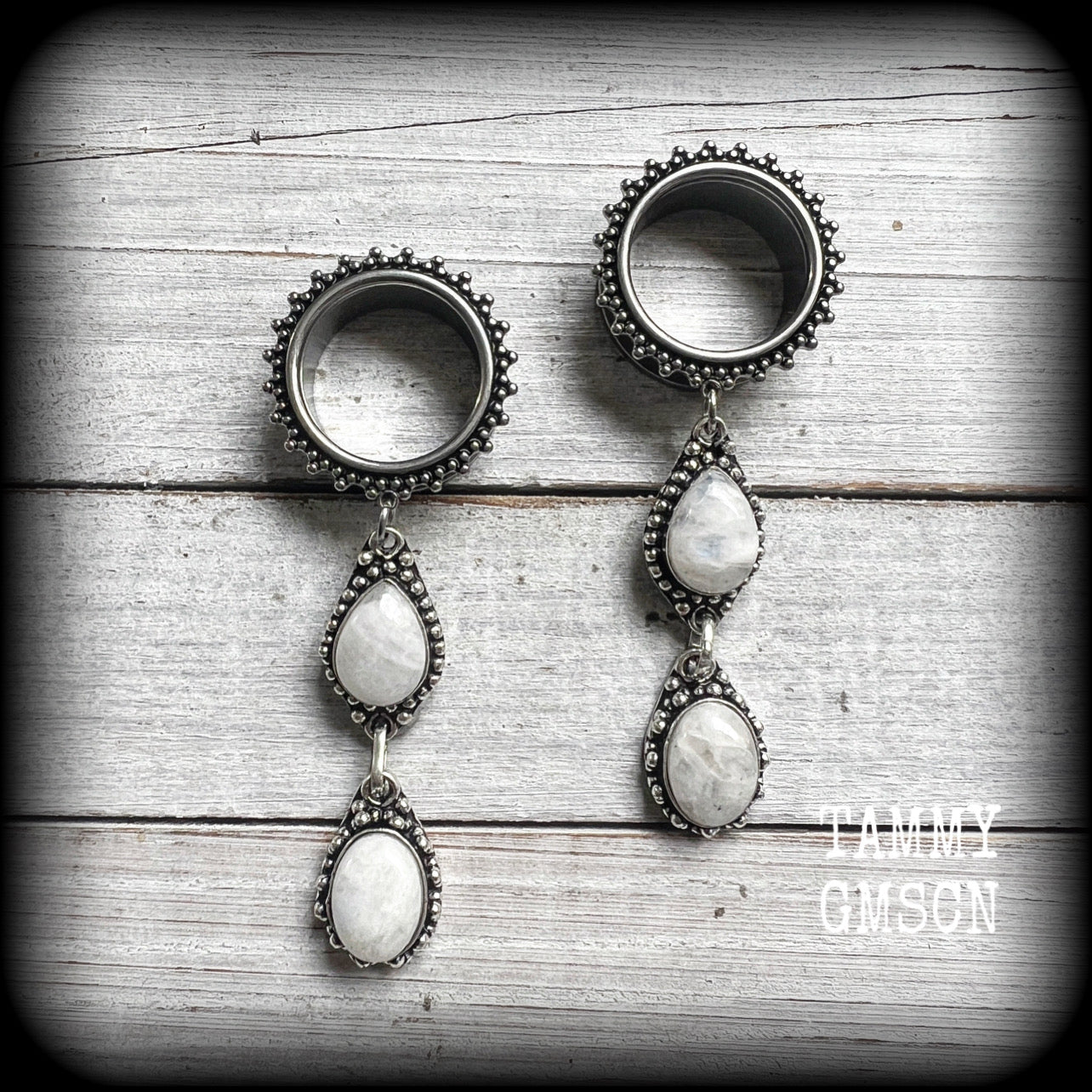 These gorgeous tunnel earrings feature beautiful polished rainbow moonstone gemstones, weigh approx 17 grams each and measure approx 8.5cms from tip to tip.

This pair have been made with 7/8" gauge (22mm) gauge ornate surgical steel screw fit tunnels-for stretched lobes.