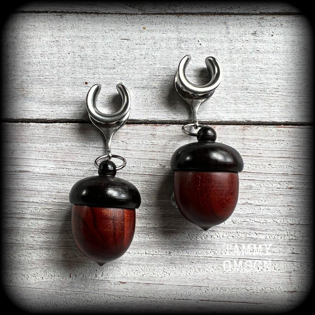 These gorgeous carved red Sandalwood acorn stash pot earrings weigh in at only 7 grams a piece, and measure just on 6cms from tip to tip.

This pair has been made with 1/2” gauge (12mm) surgical steel cradles, suitable for stretched lobes.