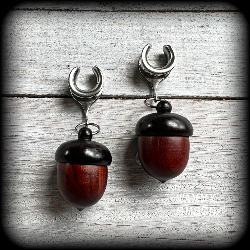These gorgeous carved red Sandalwood acorn stash pot earrings weigh in at only 7 grams a piece, and measure just on 6cms from tip to tip.

This pair has been made with 1/2” gauge (12mm) surgical steel cradles, suitable for stretched lobes.