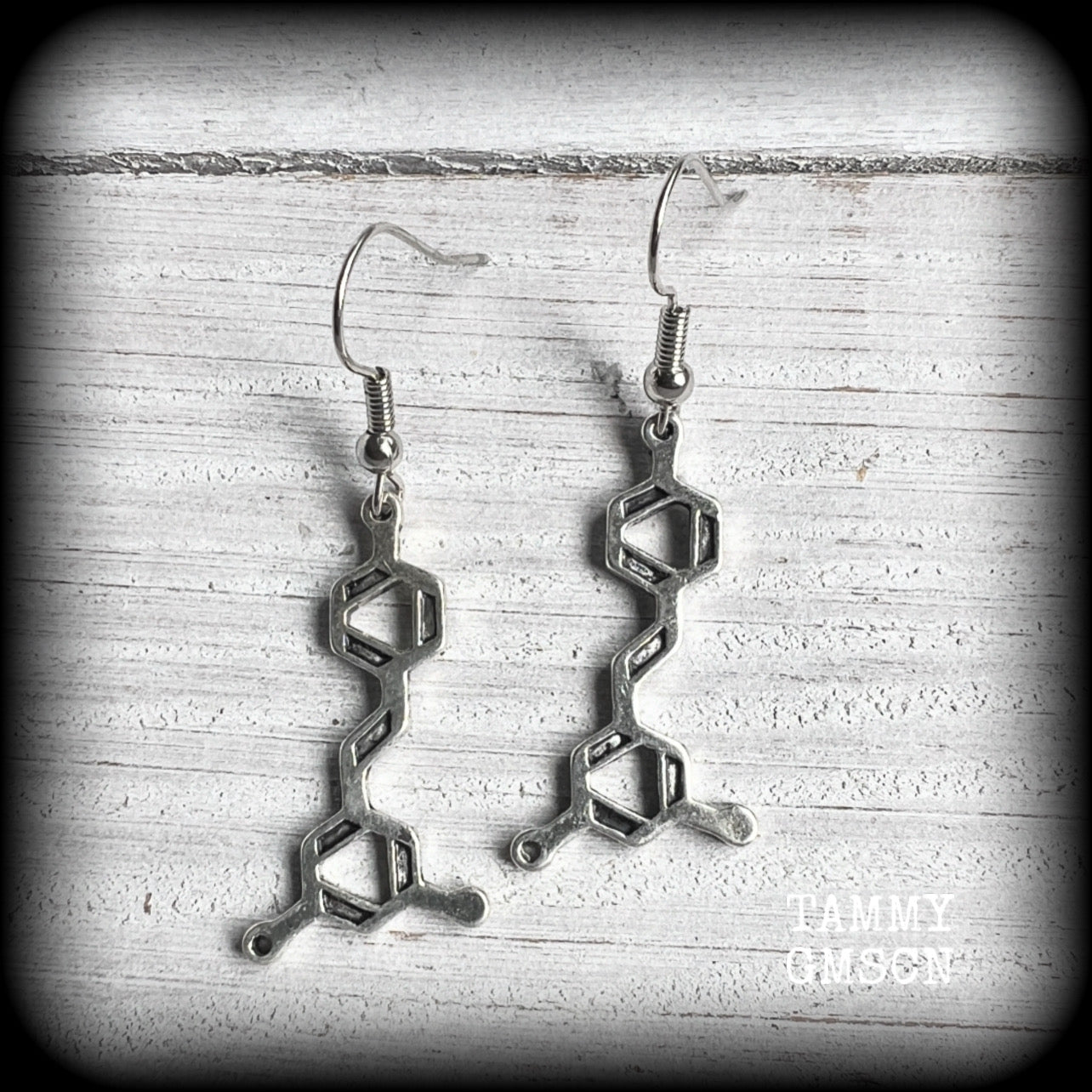 These awesome earrings feature red wine molecules, measuring just under 5cms from tip to tip, and are nice and lightweight, weighing only a few grams each.

This pair have been made with stainless steel french hooks, suitable for pierced ears.