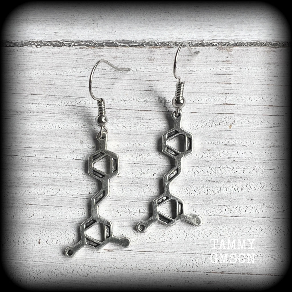 These awesome earrings feature red wine molecules, measuring just under 5cms from tip to tip, and are nice and lightweight, weighing only a few grams each.

This pair have been made with stainless steel french hooks, suitable for pierced ears.
