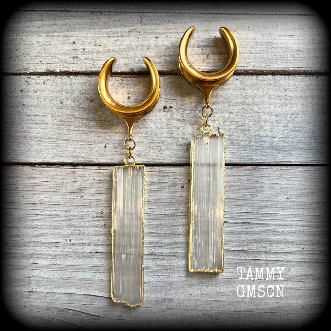 Measuring just over 10 from tip to tip, and weighing around 14 grams each a piece, these Selenite gauged earrings are simply beautiful!

This pair has been made on 7/8” gauge (22mm) surgical steel cradles, to be worn in stretched lobes.