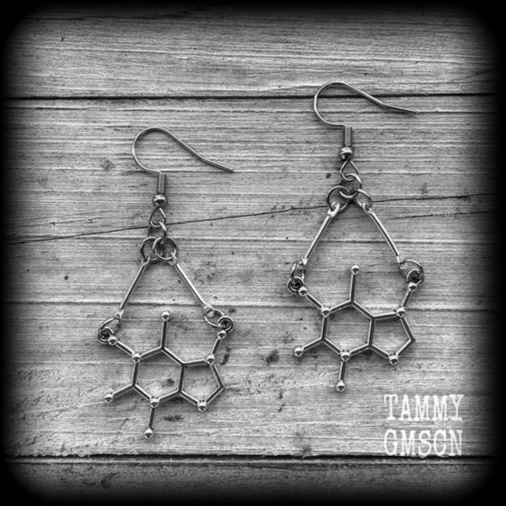 This pair of earrings features antique silver caffeine molecules, measuring just under 6cms from tip to tip, and weighing only a few grams each.

This pair has been made with stainless steel french hooks, to be worn in pierced ears.