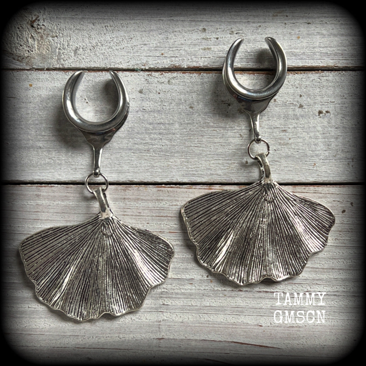 Inspired by Gaia, these beautiful big gauged earrings feature antique silver ginkgo leaves, weighing approx 16 grams a piece, and are nice and dangly, measuring just over 8cms from tip to tip.

This pair has been made on 3/4” gauge (19mm) surgical steel cradles, to be worn in stretched lobes.