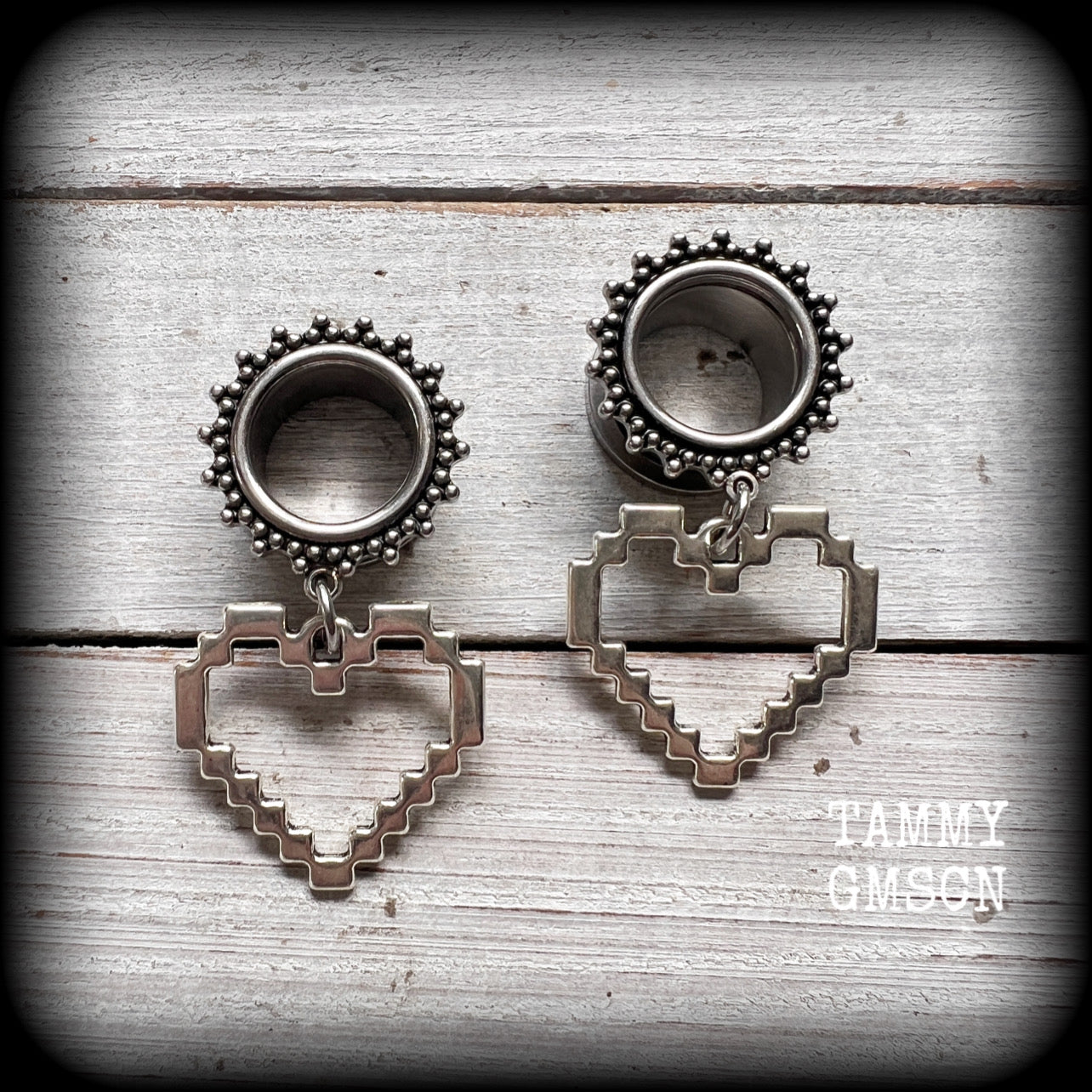 Featuring super retro antique silver pixel hearts, these tunnel earrings measure 4.5cm from tip to tip, and weigh approx 8 grams each.

This pair has been made on 9/16&quot; (14mm) ornate surgical steel tunnels, suitable for stretched lobes.