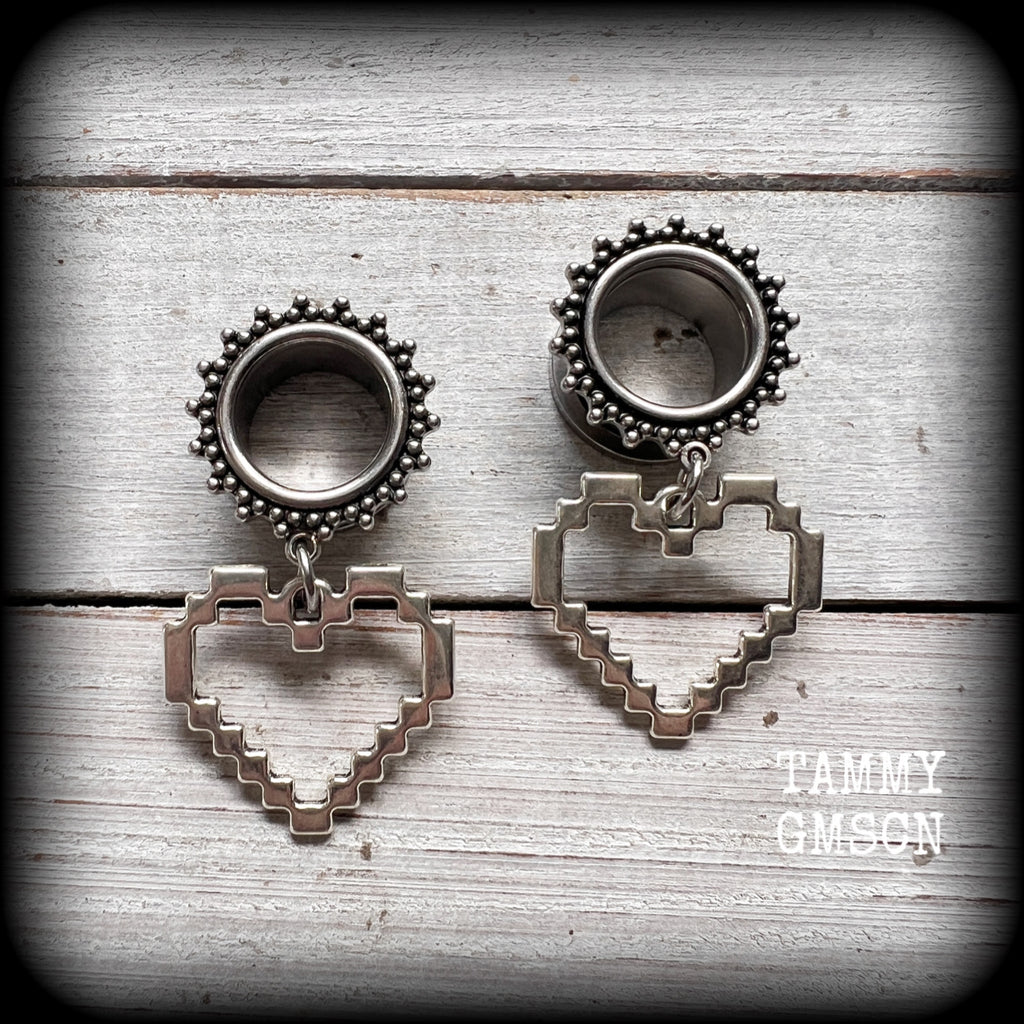 Featuring super retro antique silver pixel hearts, these tunnel earrings measure 4.5cm from tip to tip, and weigh approx 8 grams each.

This pair has been made on 9/16&quot; (14mm) ornate surgical steel tunnels, suitable for stretched lobes.
